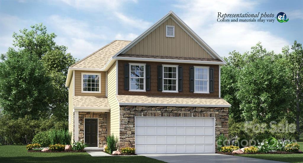 5763 Soft Shell Drive, Unit 313 Lancaster, SC 29720 - Photo 10 of 26 a front view of a house with a garden and garage