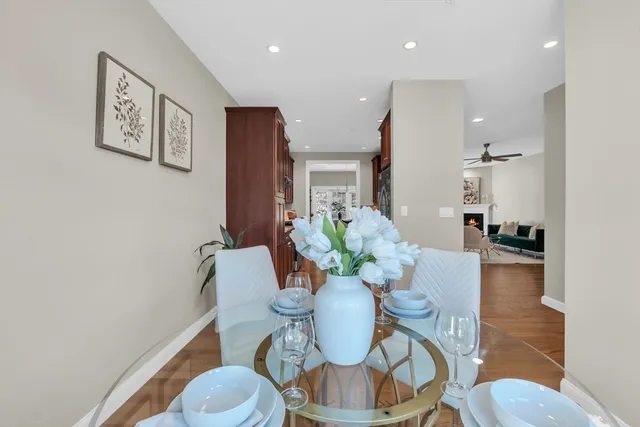 a dining room with furniture and wooden floor