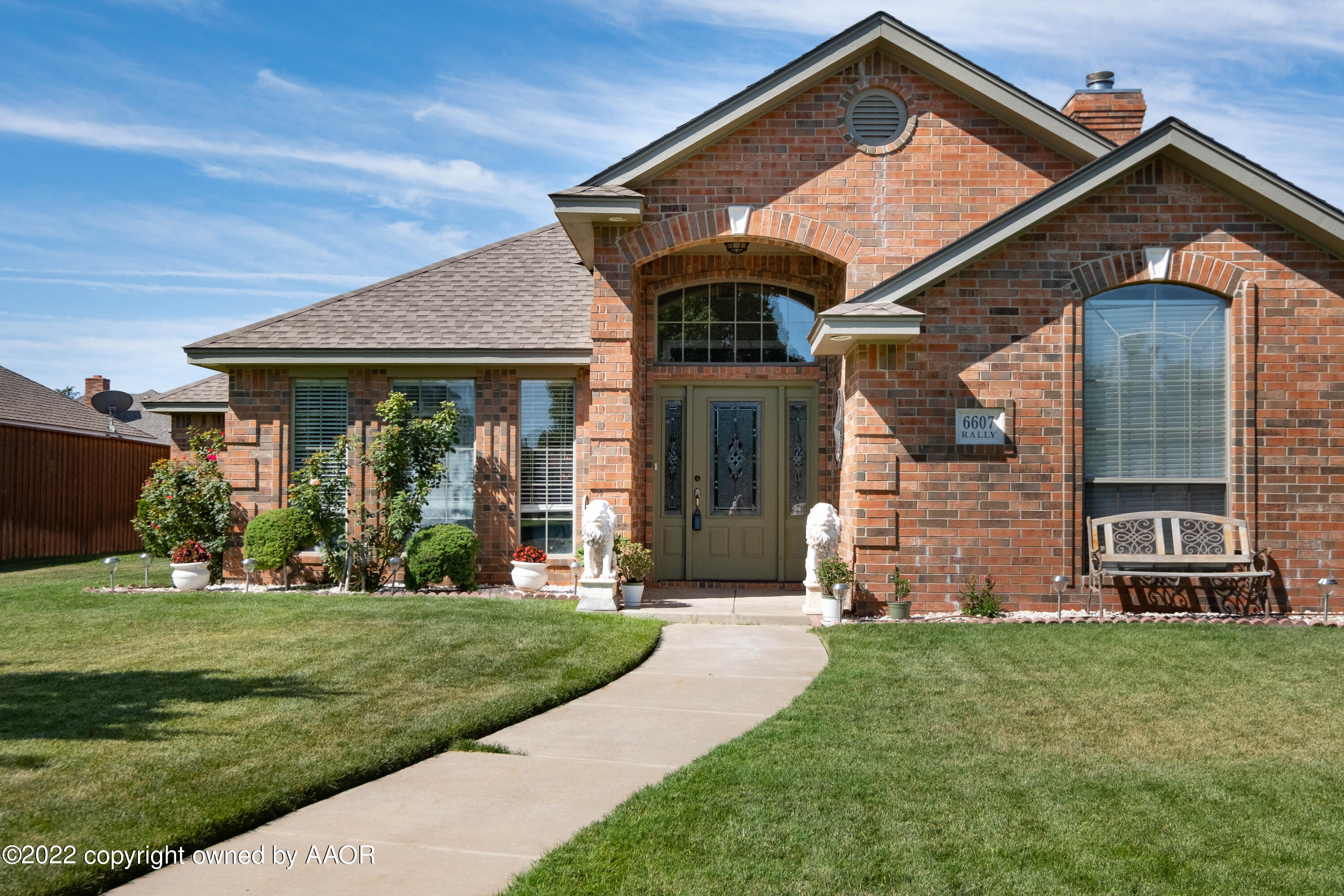 front view of a house with a yard