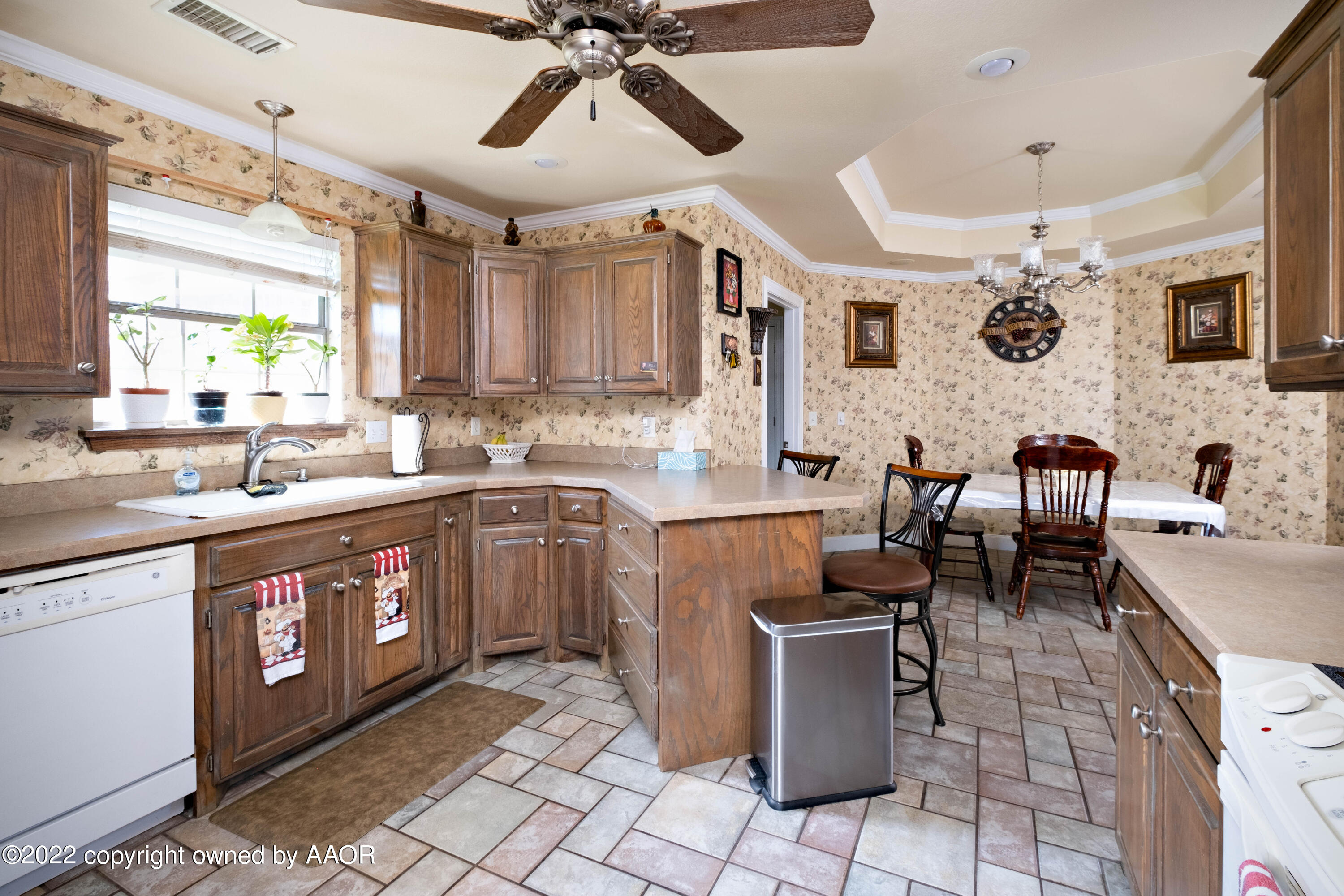 6607 Rally Road Amarillo, TX 79119 - Photo 12 of 34 a kitchen with stainless steel appliances kitchen island granite countertop a sink and cabinets
