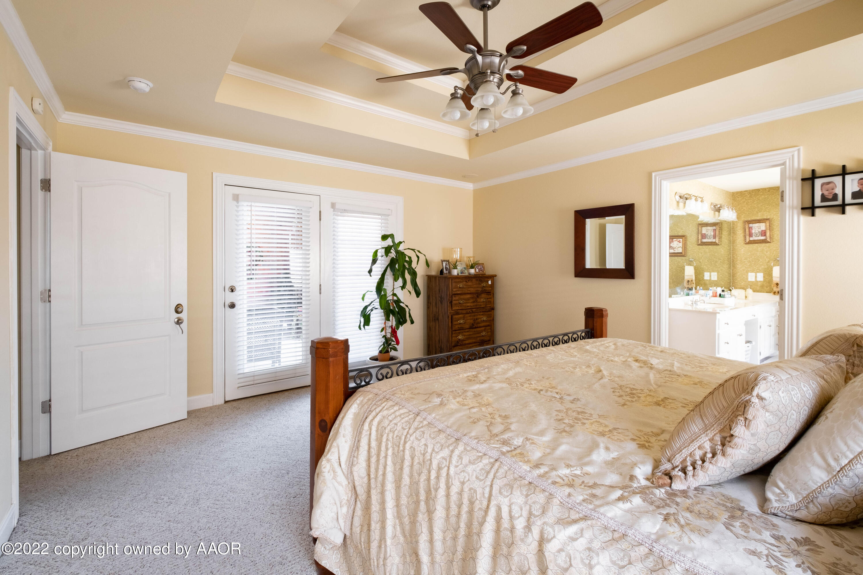 6607 Rally Road Amarillo, TX 79119 - Photo 18 of 34 a spacious bedroom with a bed and ceiling fan