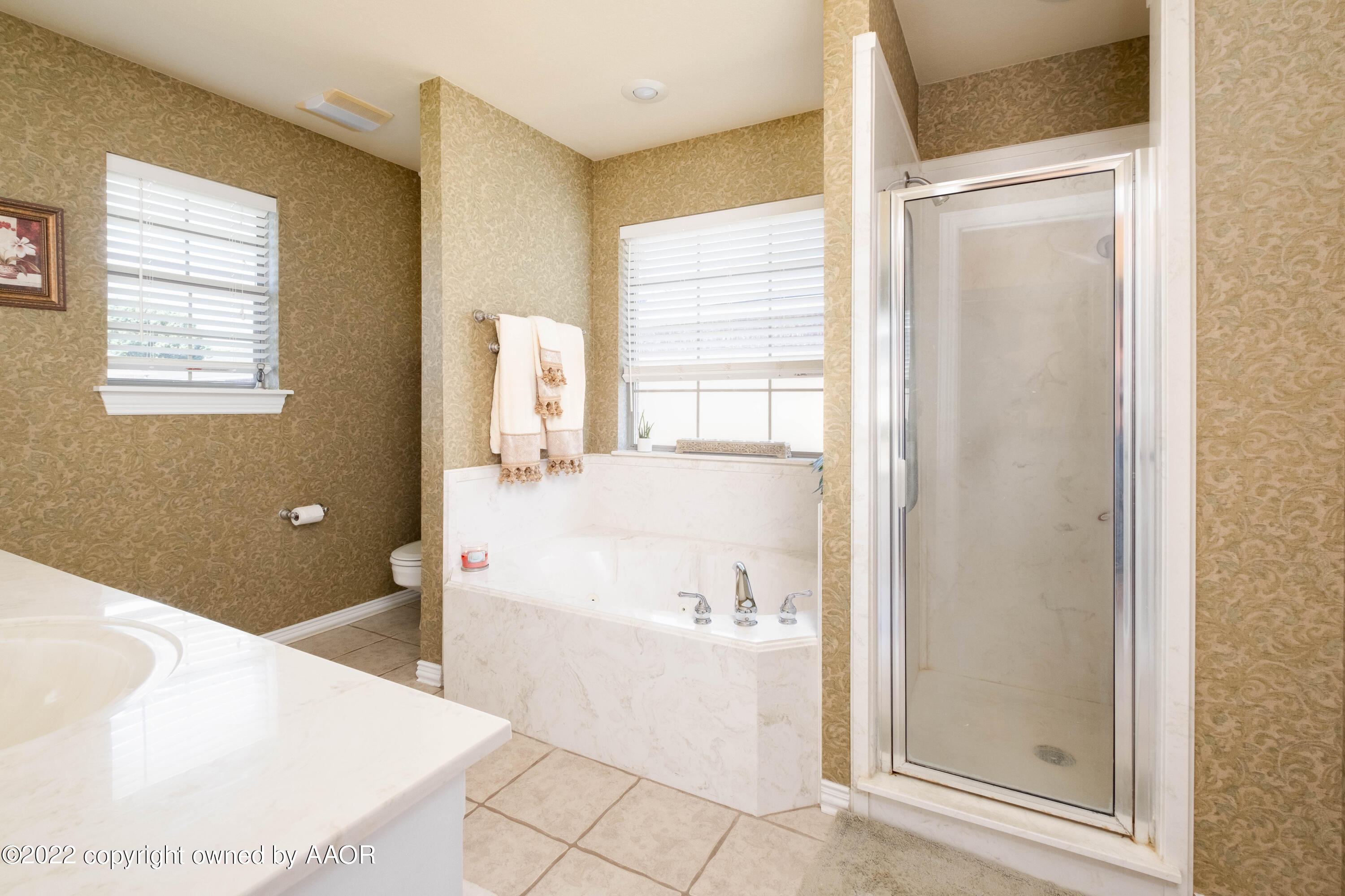 6607 Rally Road Amarillo, TX 79119 - Photo 20 of 34 a bathroom with a bathtub and a sink