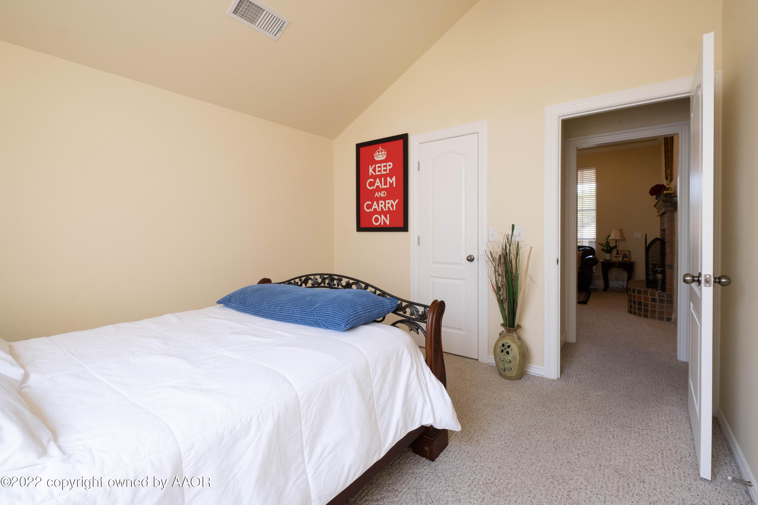 6607 Rally Road Amarillo, TX 79119 - Photo 24 of 34 a bedroom with a bed and a mirror