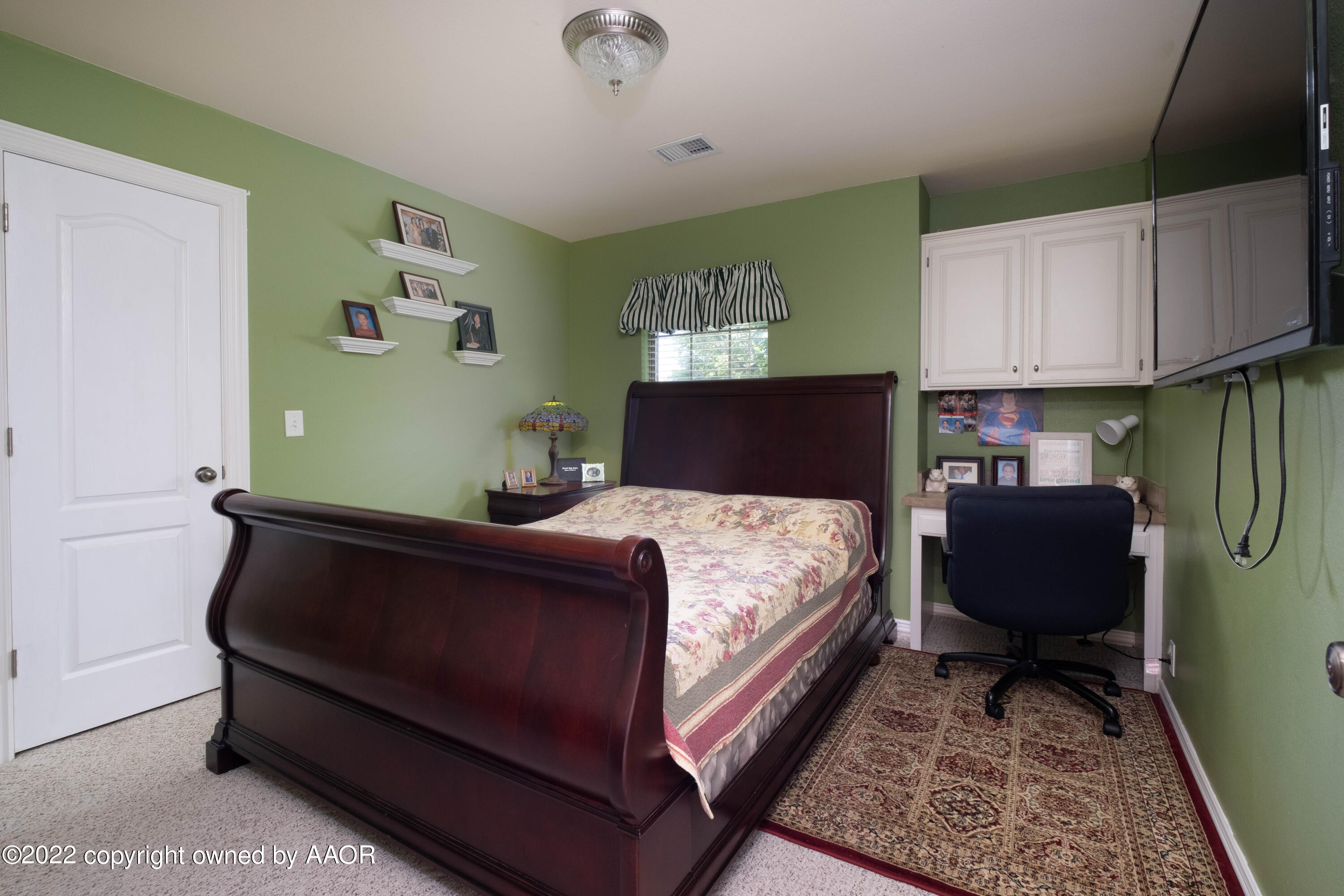 6607 Rally Road Amarillo, TX 79119 - Photo 25 of 34 a bedroom with a bed and window
