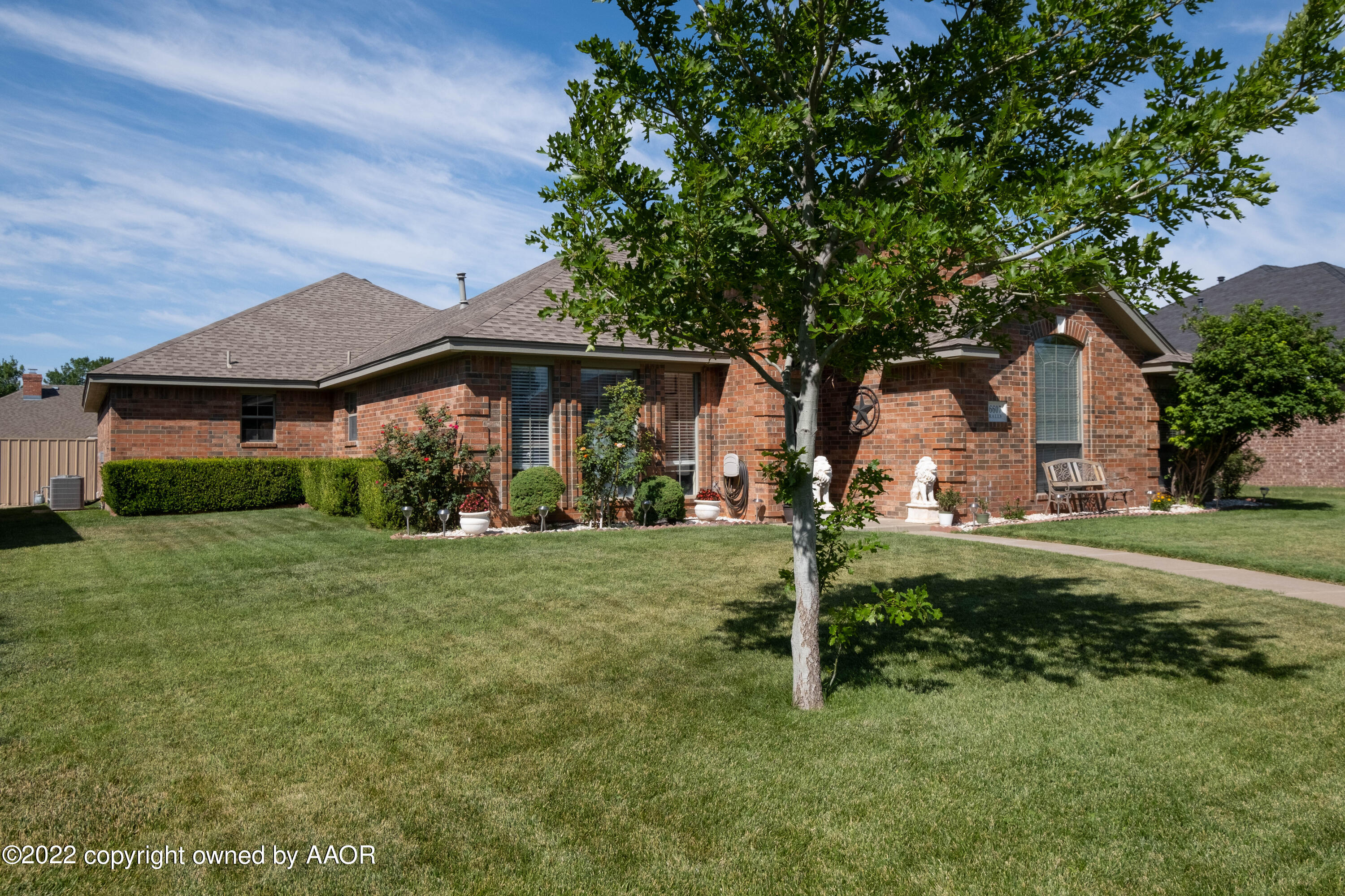 6607 Rally Road Amarillo, TX 79119 - Photo 3 of 34 a front view of a house with a yard