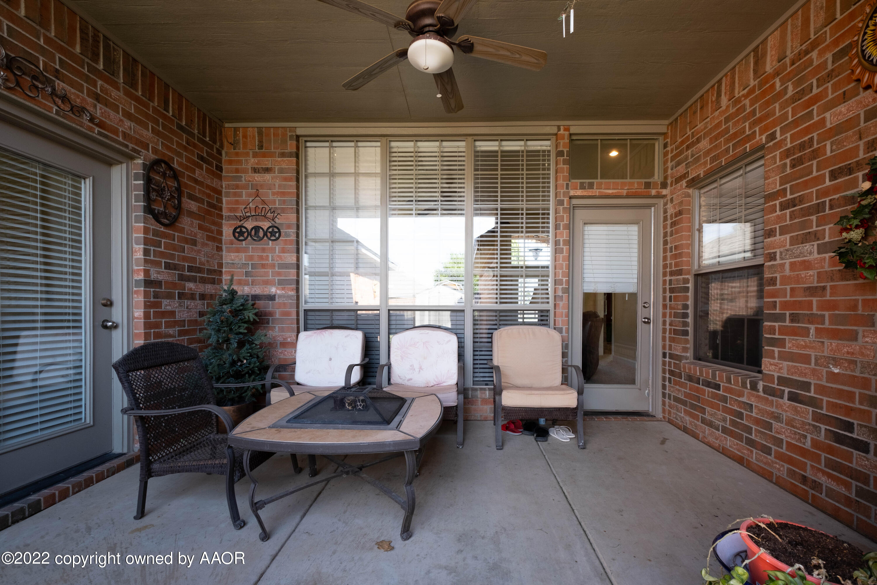 6607 Rally Road Amarillo, TX 79119 - Photo 31 of 34 a outdoor living space with furniture and a fireplace