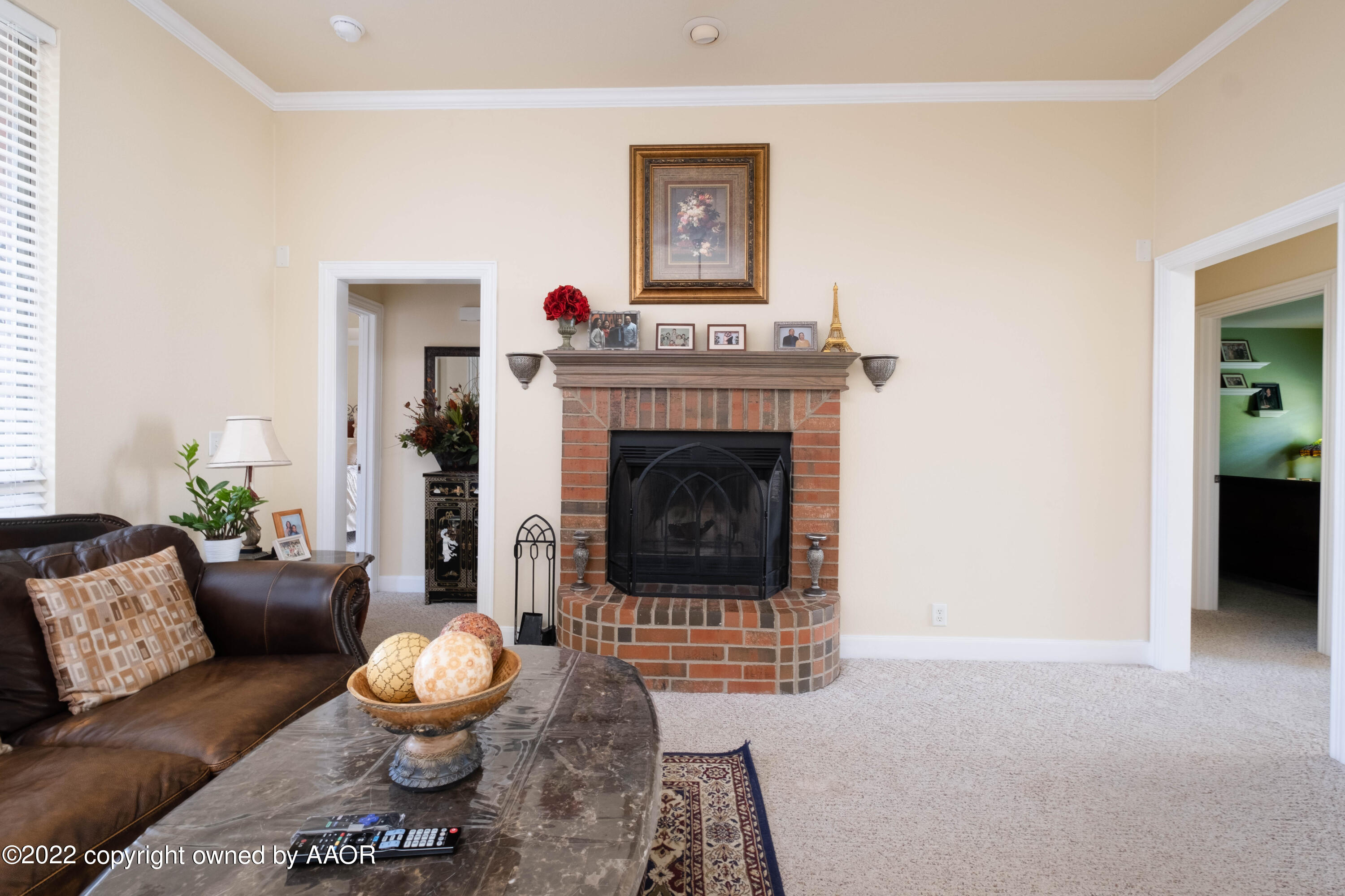 6607 Rally Road Amarillo, TX 79119 - Photo 6 of 34 a living room with furniture and a fireplace