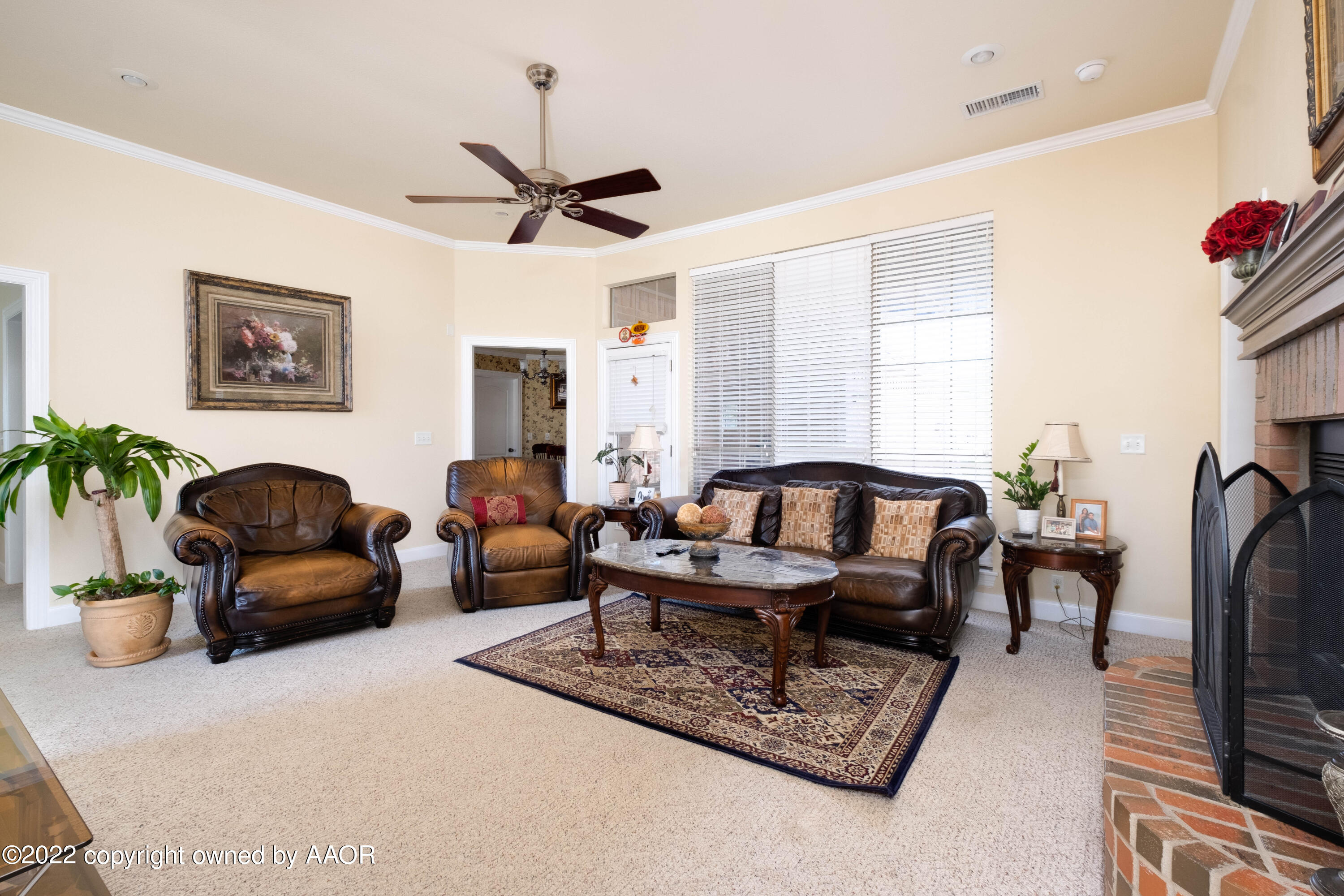 6607 Rally Road Amarillo, TX 79119 - Photo 7 of 34 a living room with furniture potted plant and a window