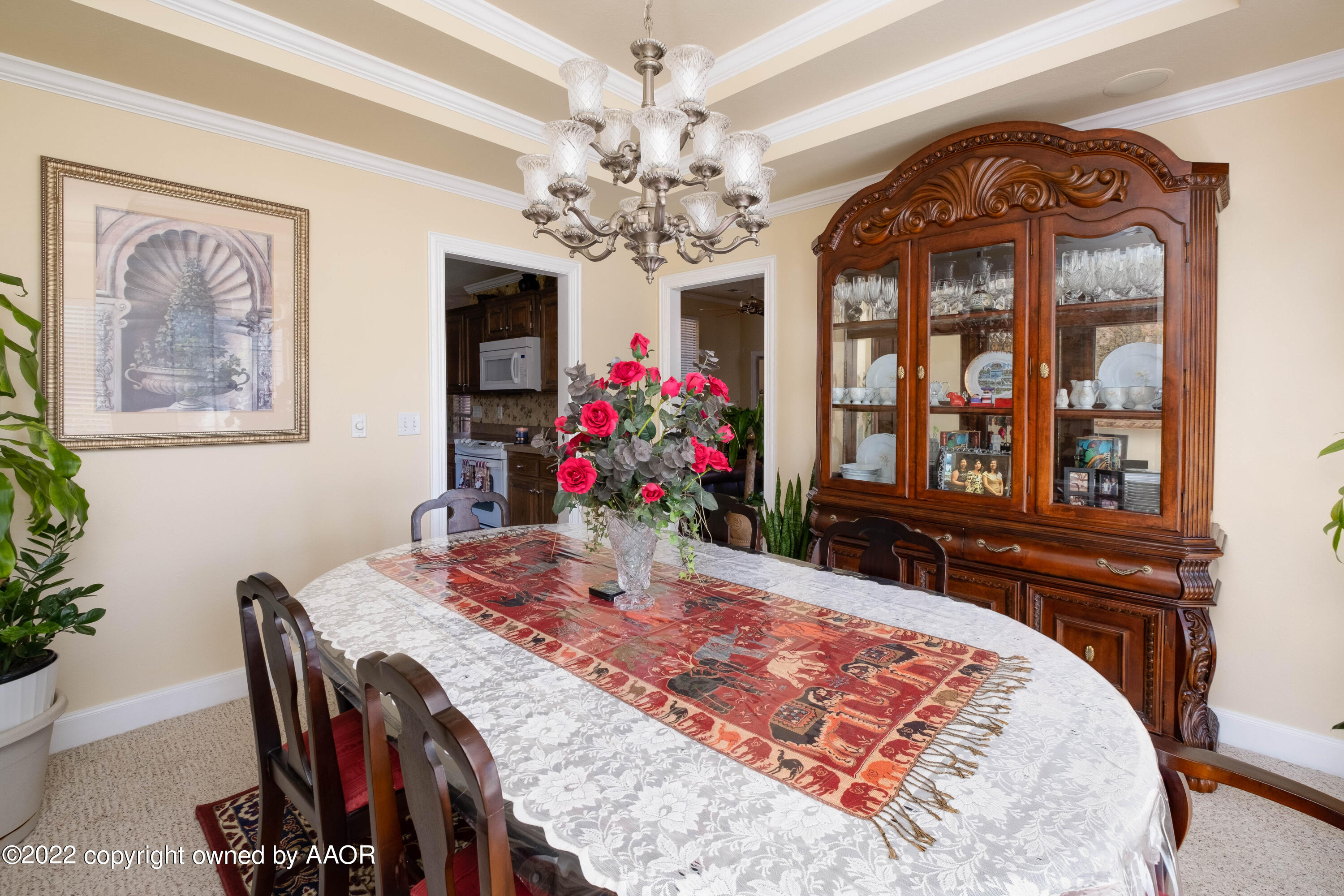 6607 Rally Road Amarillo, TX 79119 - Photo 9 of 34 a view of a dining room with furniture and a chandelier