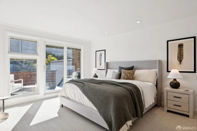 a bedroom with a bed and a cabinets