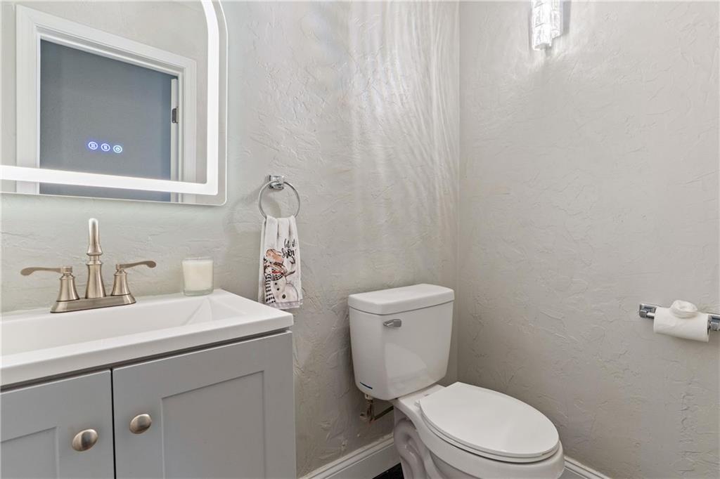 31 Harrison Street Pittsburgh, PA 15205 - Photo 11 of 32 a bathroom with a toilet a sink and mirror