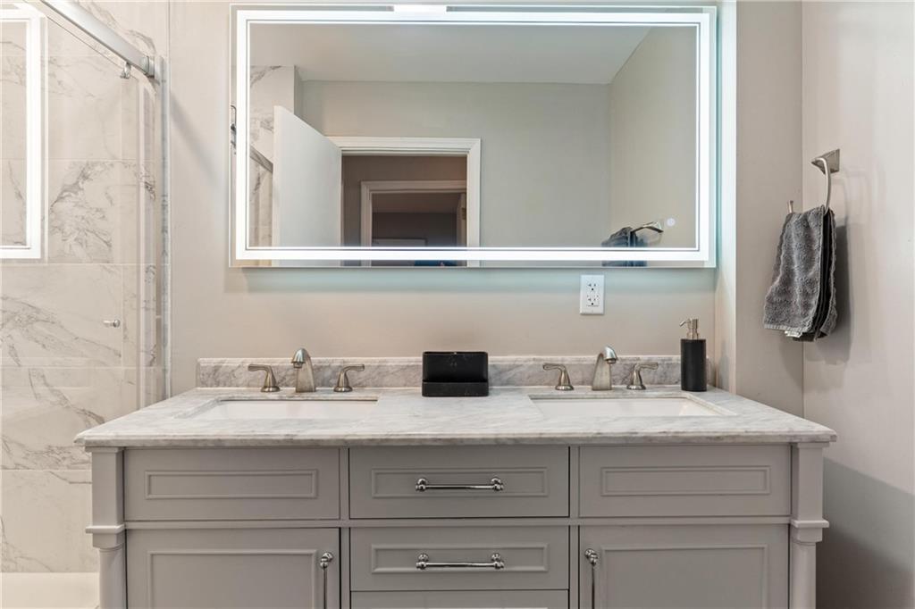 31 Harrison Street Pittsburgh, PA 15205 - Photo 19 of 32 a bathroom with a sink and a mirror