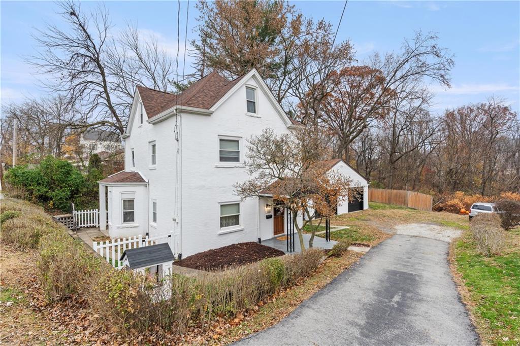 31 Harrison Street Pittsburgh, PA 15205 - Photo 23 of 32 a front view of a house with a yard and garage