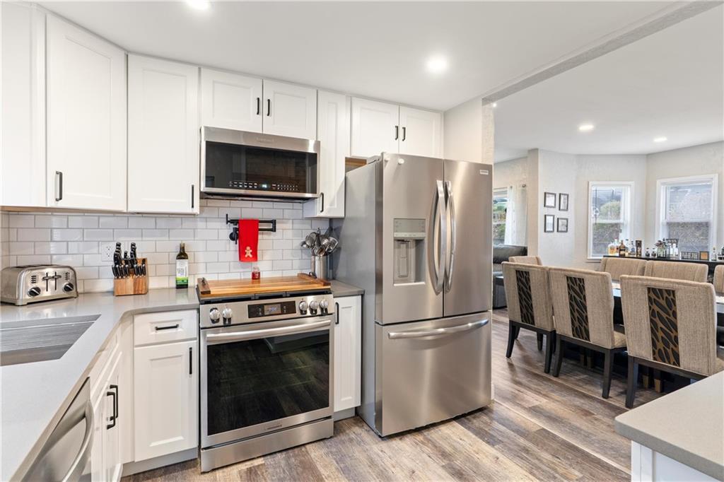 31 Harrison Street Pittsburgh, PA 15205 - Photo 8 of 32 a kitchen with white cabinets and stainless steel appliances
