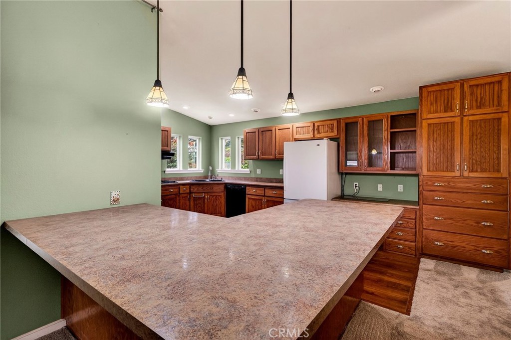 3770 Hall Road Corning, CA 96021 - Photo 15 of 64 a kitchen with a table and chairs in it
