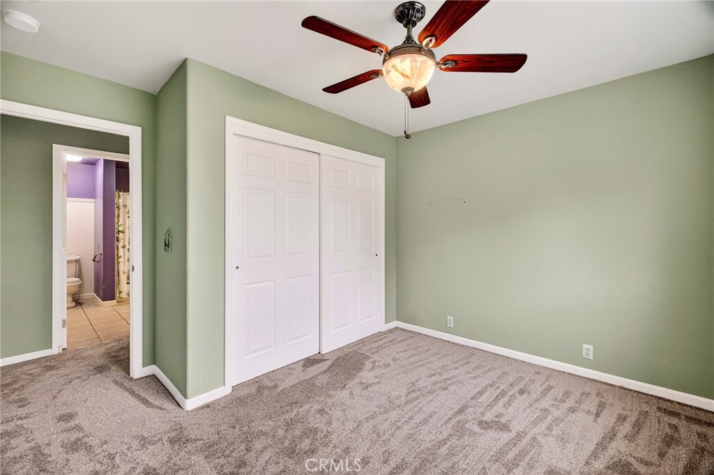3770 Hall Road Corning, CA 96021 - Photo 27 of 64 an empty room with closet and a chandelier fan