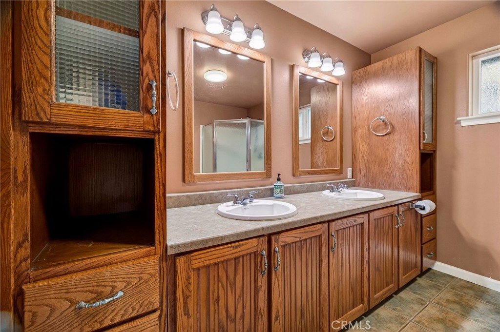 3770 Hall Road Corning, CA 96021 - Photo 32 of 64 a bathroom with a sink and a mirror