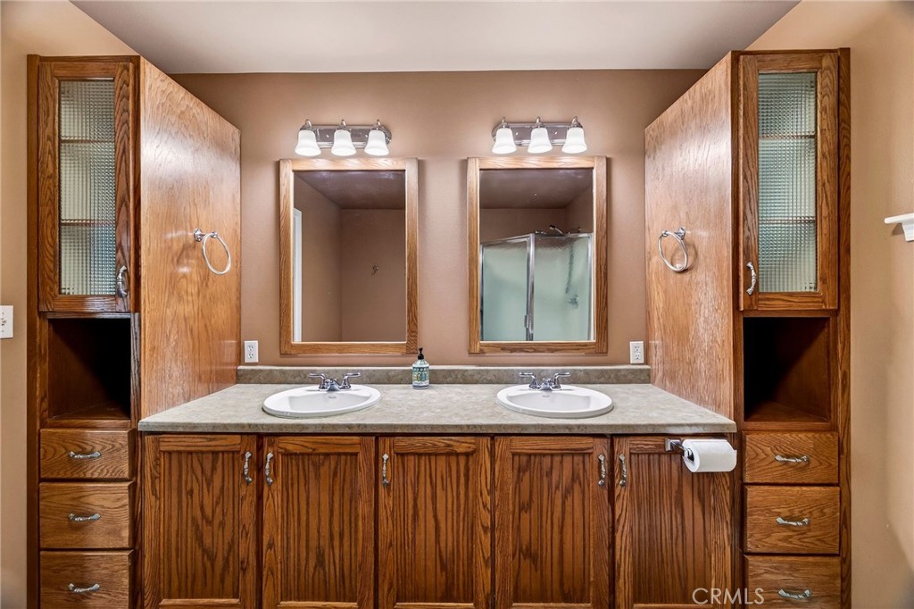 3770 Hall Road Corning, CA 96021 - Photo 34 of 64 a bathroom with a sink and a mirror