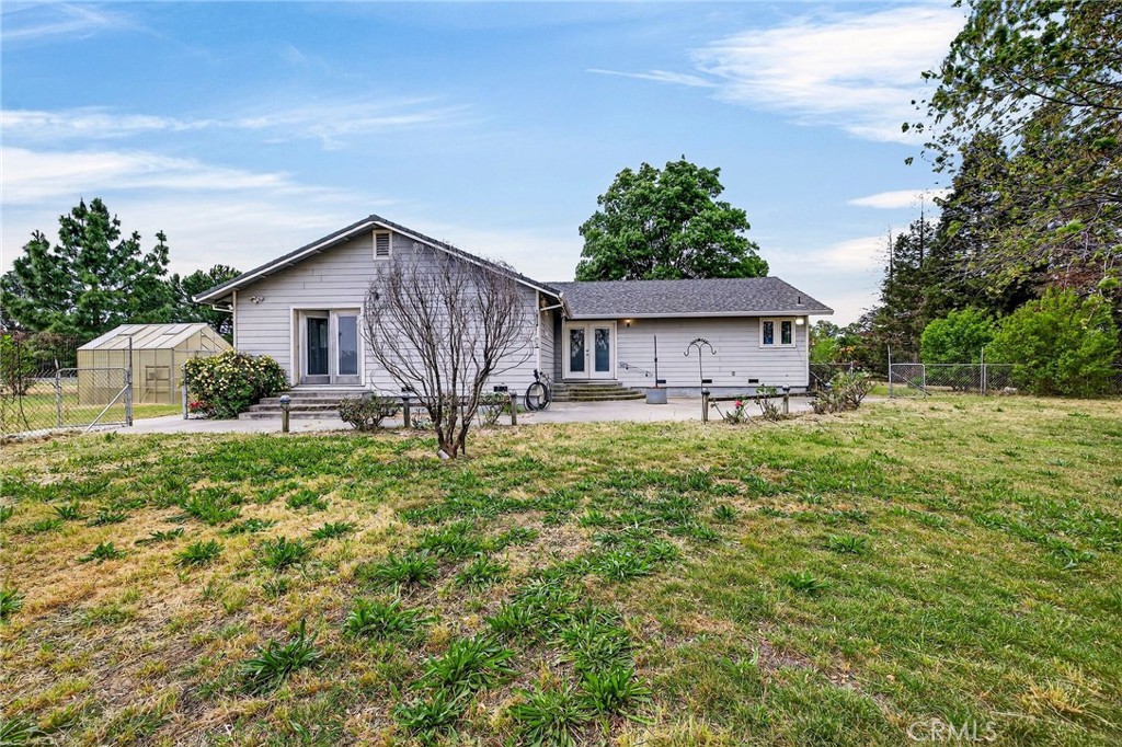 3770 Hall Road Corning, CA 96021 - Photo 43 of 64 a front view of a house with garden