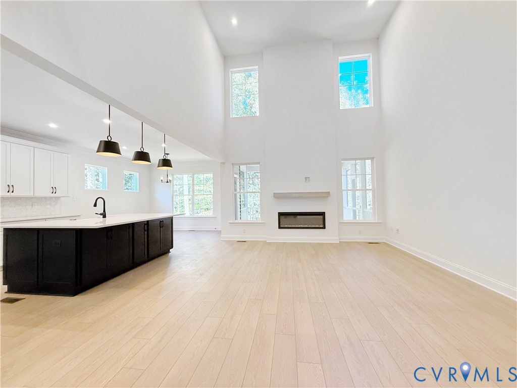 8130 Clancy Court Chesterfield, VA 23838 - Photo 11 of 36 A two-story family room with gas fireplace is perf