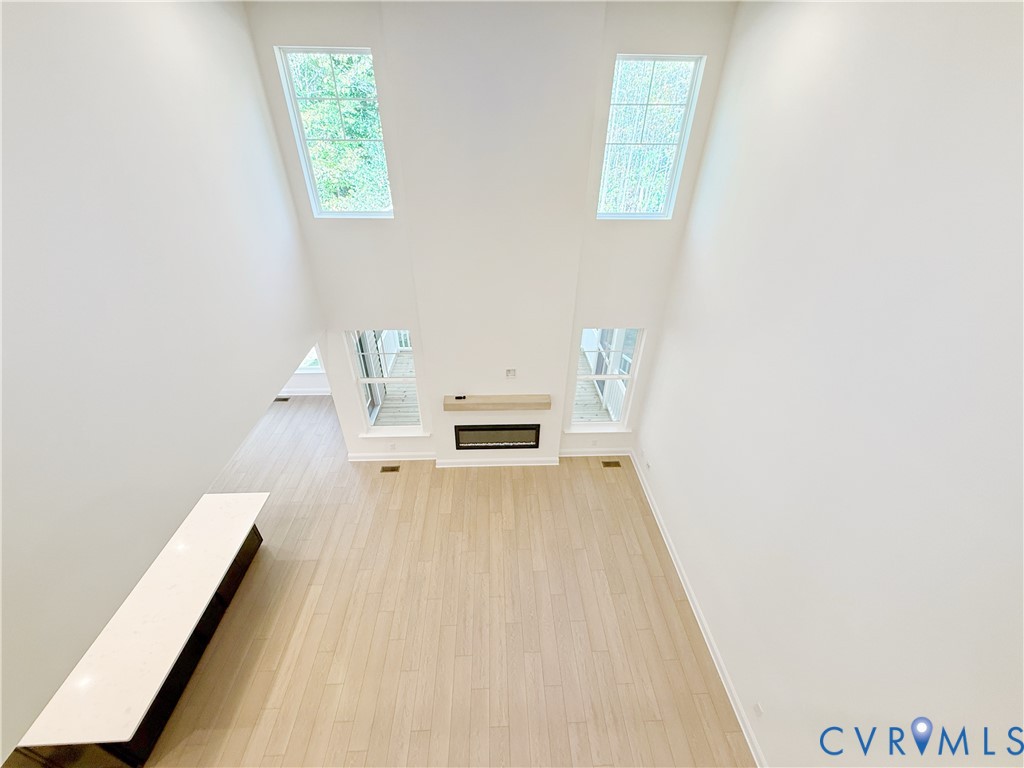 8130 Clancy Court Chesterfield, VA 23838 - Photo 12 of 36 A two-story family room with gas fireplace is perf