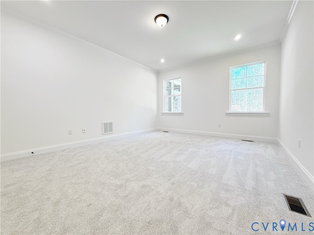 8130 Clancy Court Chesterfield, VA 23838 - Photo 14 of 36 The first-floor primary suite boasts a large walk-