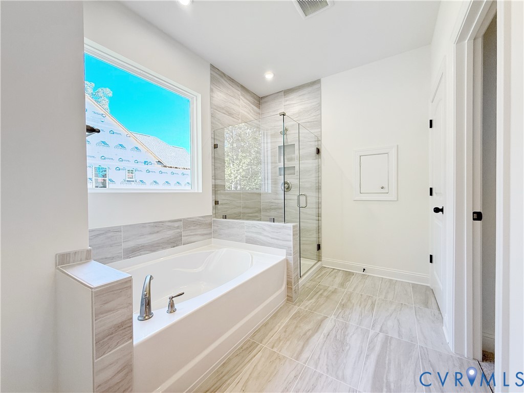 8130 Clancy Court Chesterfield, VA 23838 - Photo 17 of 36 The first-floor primary suite boasts a large walk-