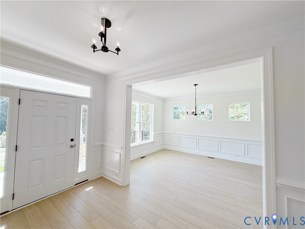 8130 Clancy Court Chesterfield, VA 23838 - Photo 2 of 36 The entry offers a formal dining room directly off