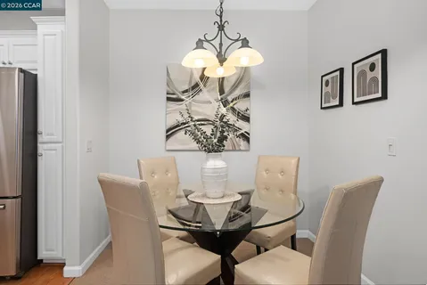a living room with fireplace furniture and a large window