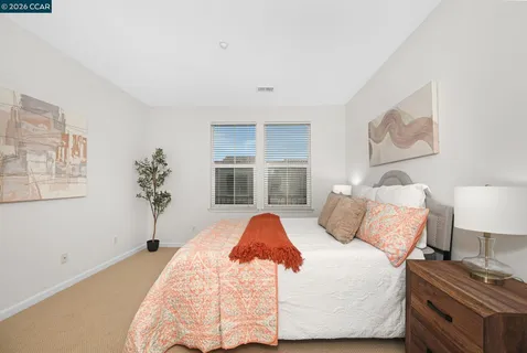 a bathroom with a double vanity sink mirror and shower