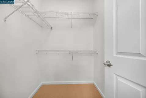 a view of a patio with a chairs and plants