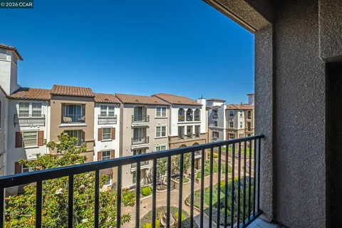 a view of a building with potted plants