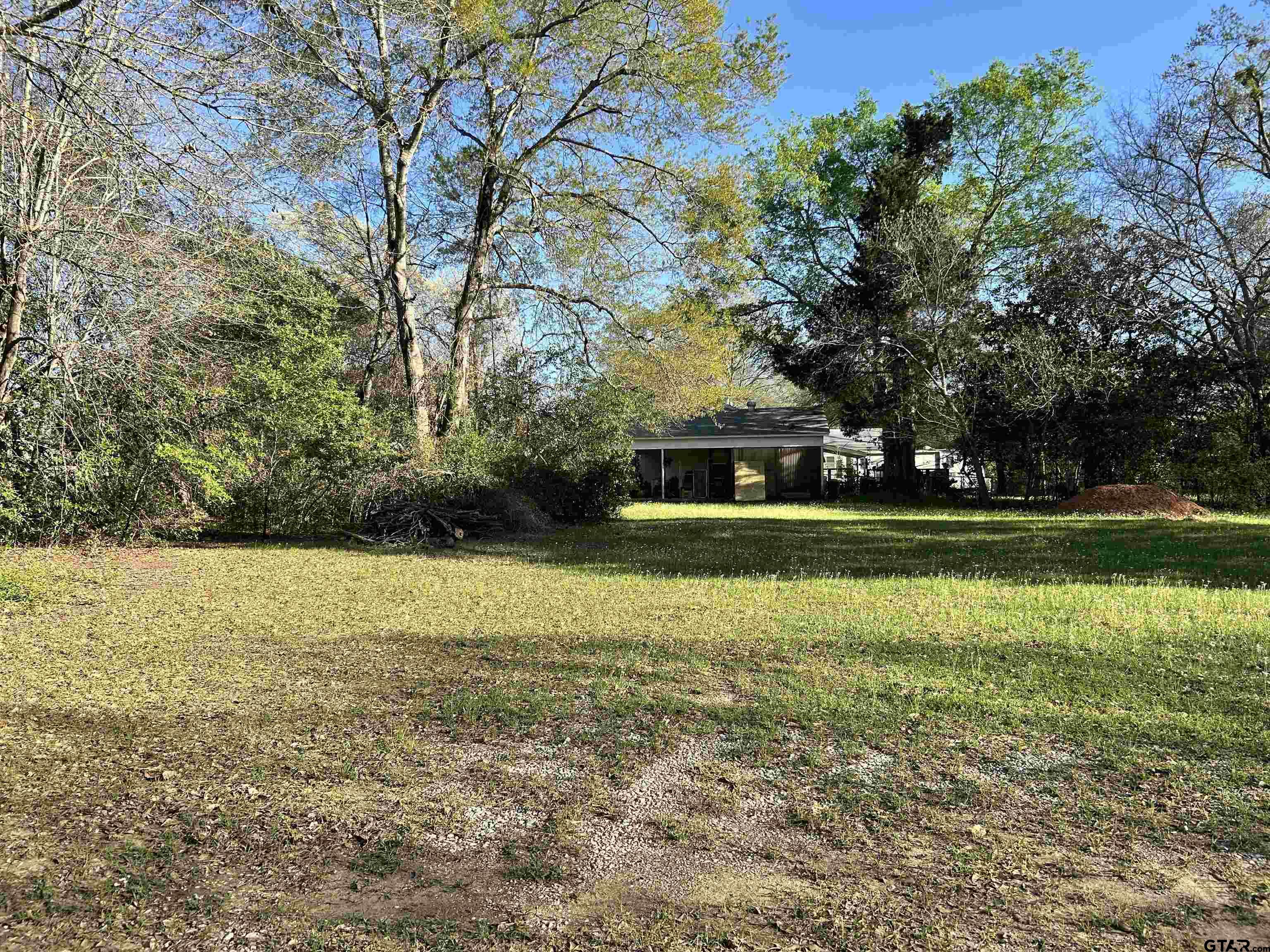 3108 Dudley Road Kilgore, TX 75662 - Photo 5 of 6 a front view of a house with a yard