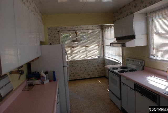 210 Wonder Street Reno, NV 89502 - Photo 5 of 7 a bedroom with a bed and a window
