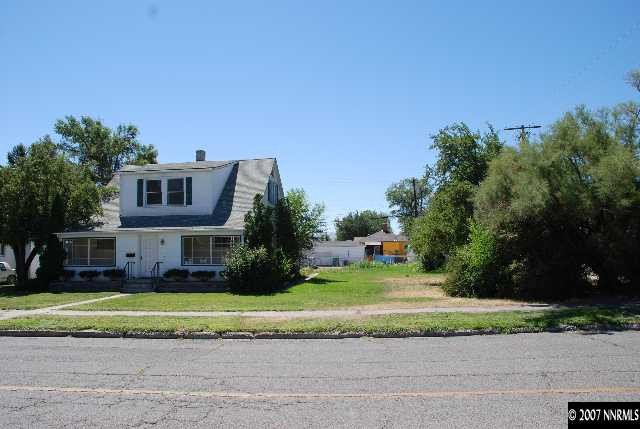 210 Wonder Street Reno, NV 89502 - Photo 6 of 7 a front view of a house with a yard and a garage