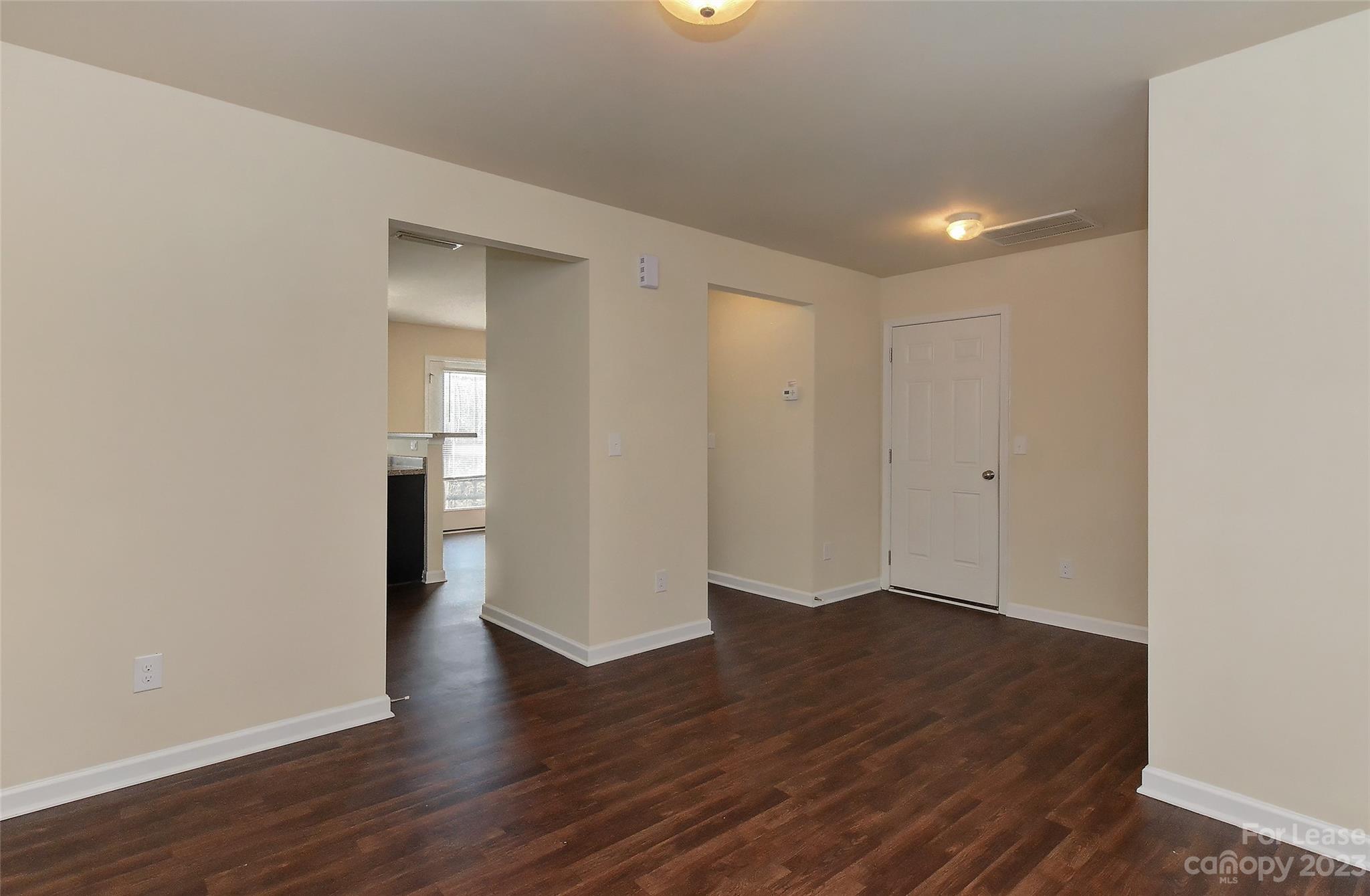 2010 Turtle Point Road Charlotte, NC 28262 - Photo 7 of 39 wooden floor in an empty room with a window