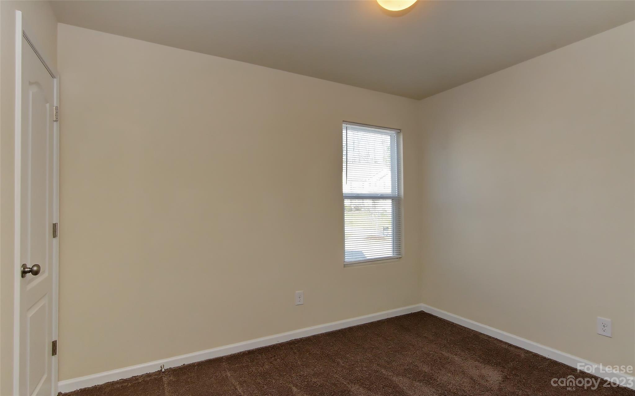 2010 Turtle Point Road Charlotte, NC 28262 - Photo 8 of 39 an empty room with a window