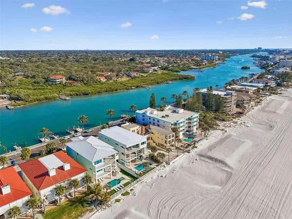 an aerial view of a house with outdoor space