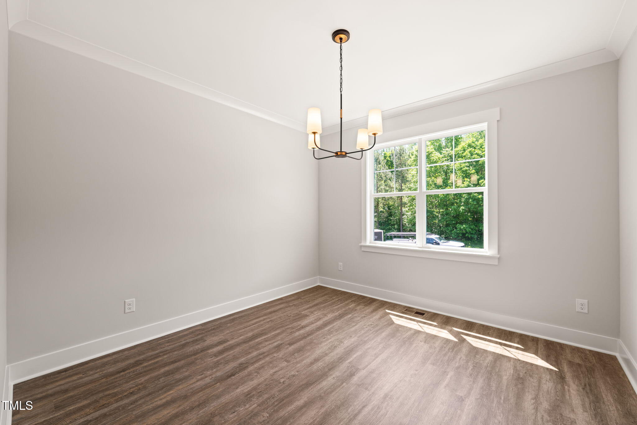 320 Pilot Ridge Road Zebulon, NC 27597 - Photo 13 of 49 a view of a room with wooden floor outdoor space and windows