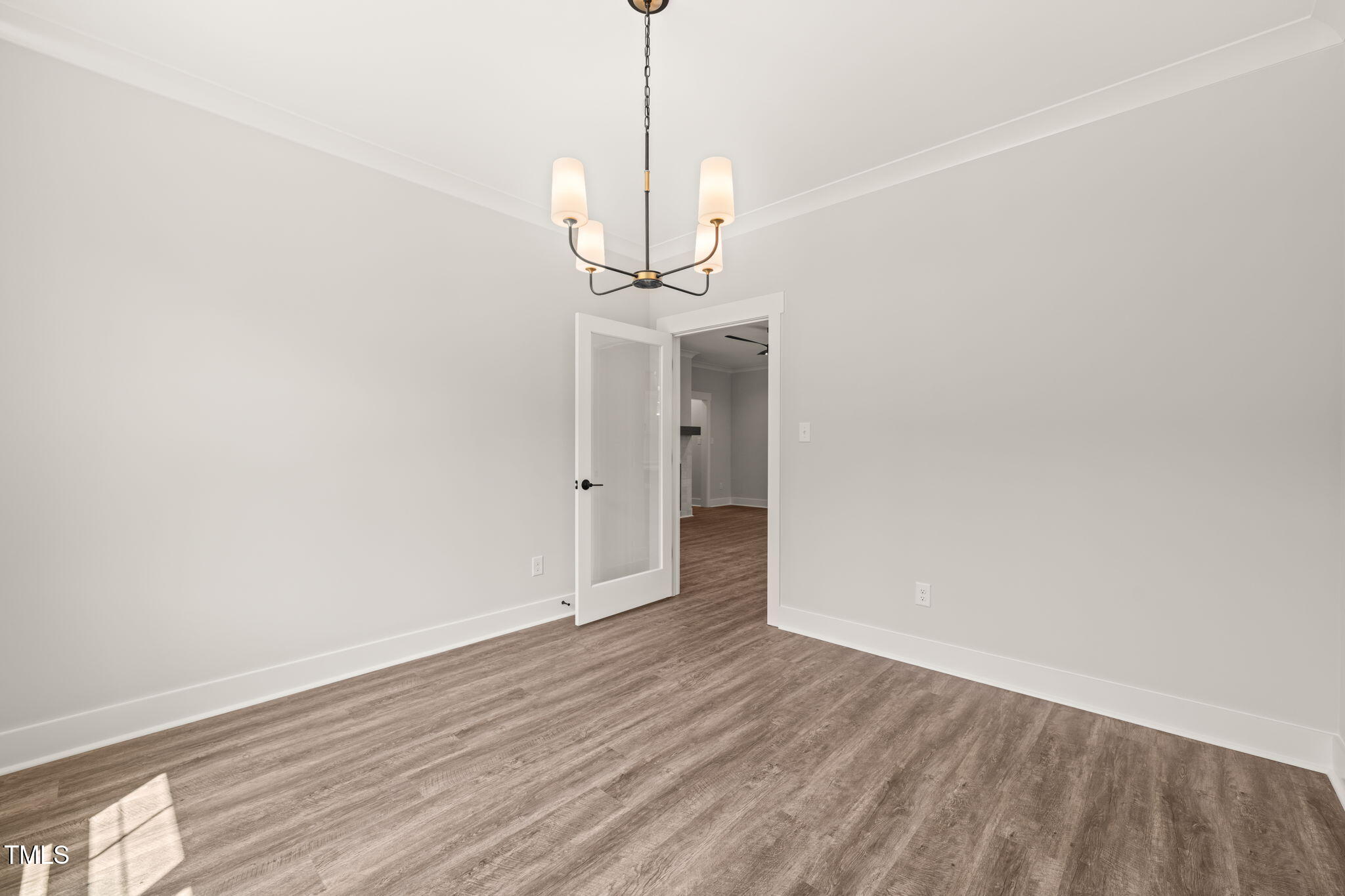 320 Pilot Ridge Road Zebulon, NC 27597 - Photo 14 of 49 a view of a room with wooden floor and white walls