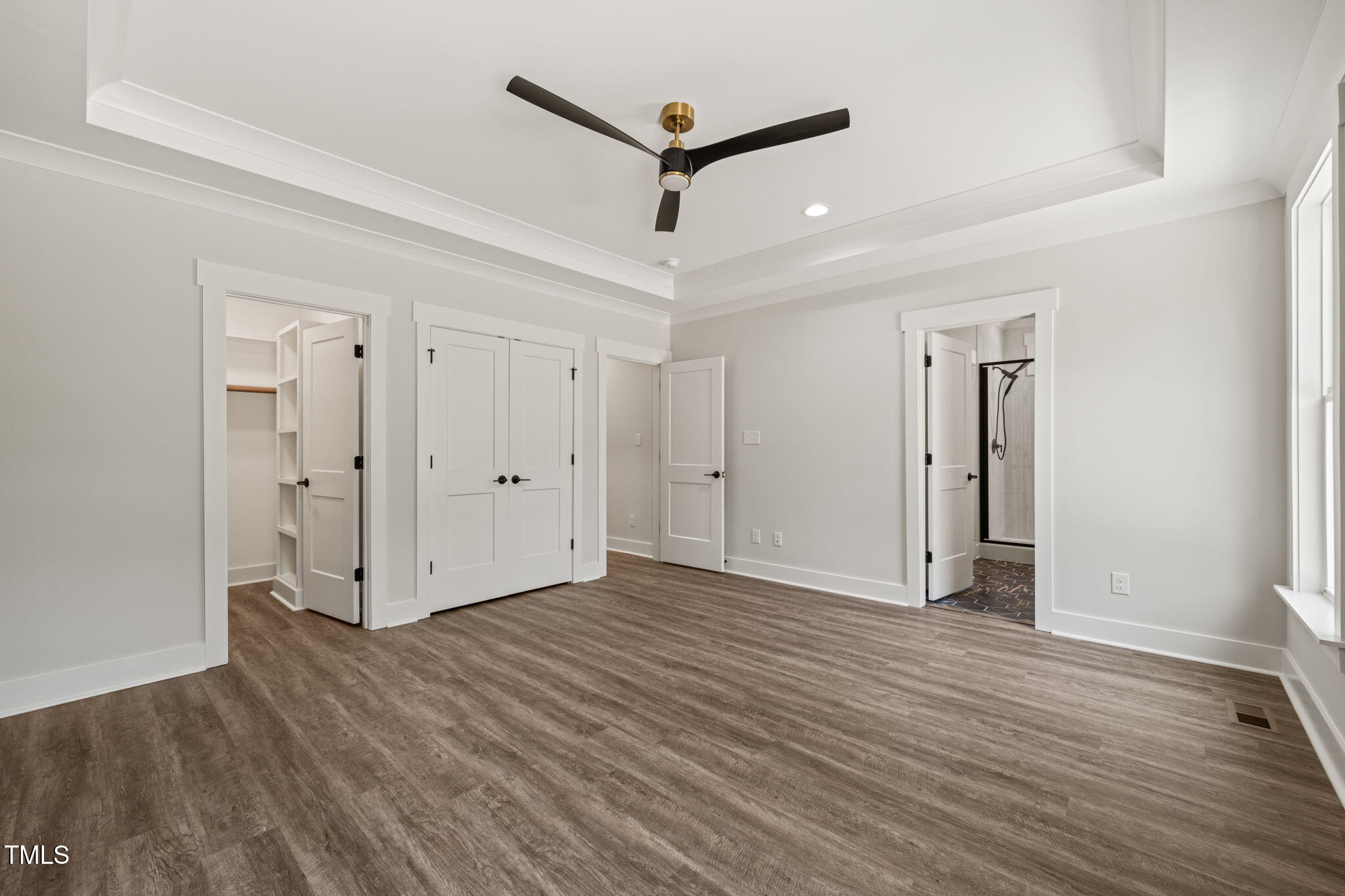 320 Pilot Ridge Road Zebulon, NC 27597 - Photo 22 of 49 a view of a room with wooden floor and a ceiling fan