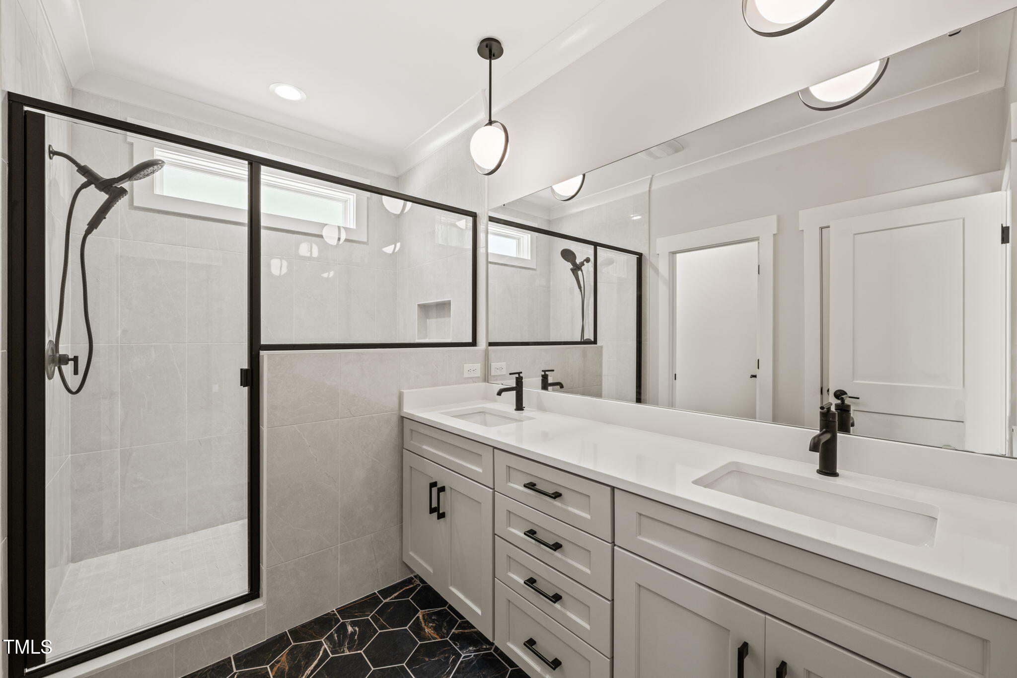 320 Pilot Ridge Road Zebulon, NC 27597 - Photo 24 of 49 a bathroom with a shower sink and mirror
