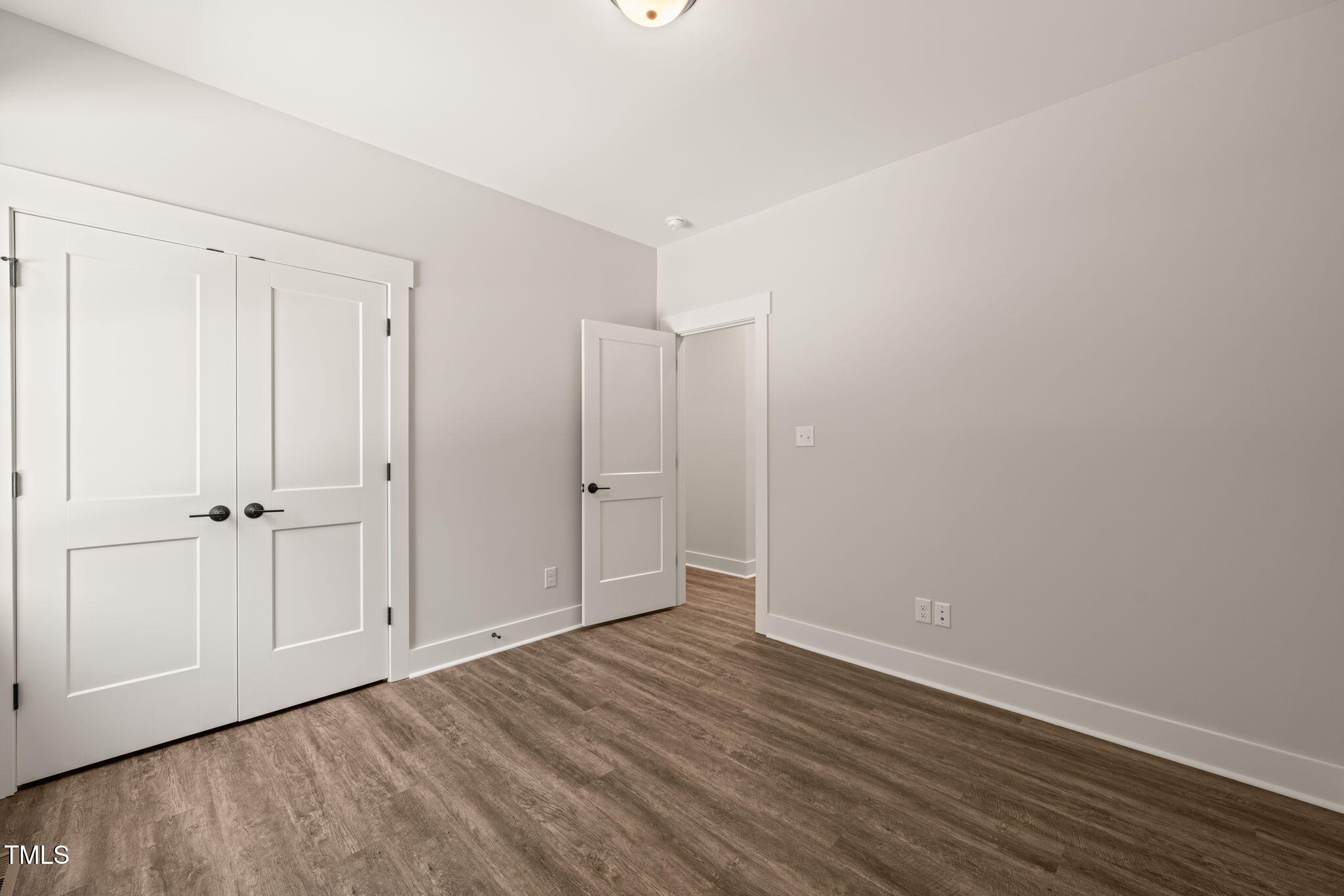 320 Pilot Ridge Road Zebulon, NC 27597 - Photo 26 of 49 a view of an empty room with closet and wooden floor