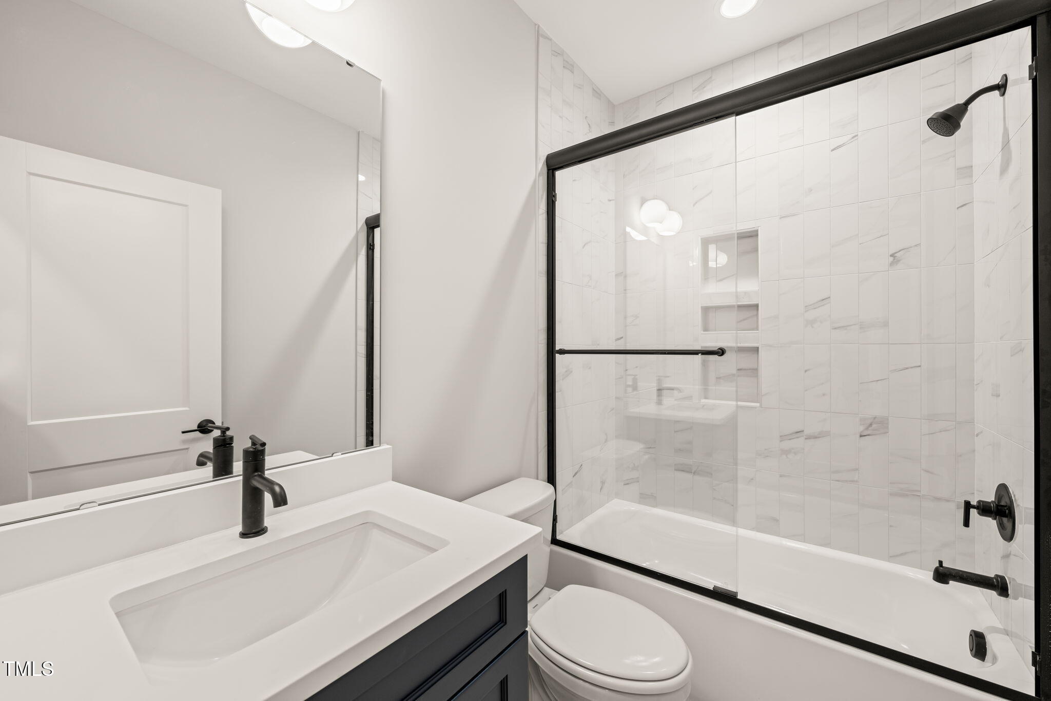320 Pilot Ridge Road Zebulon, NC 27597 - Photo 29 of 49 a bathroom with a bathtub shower sink vanity and toilet