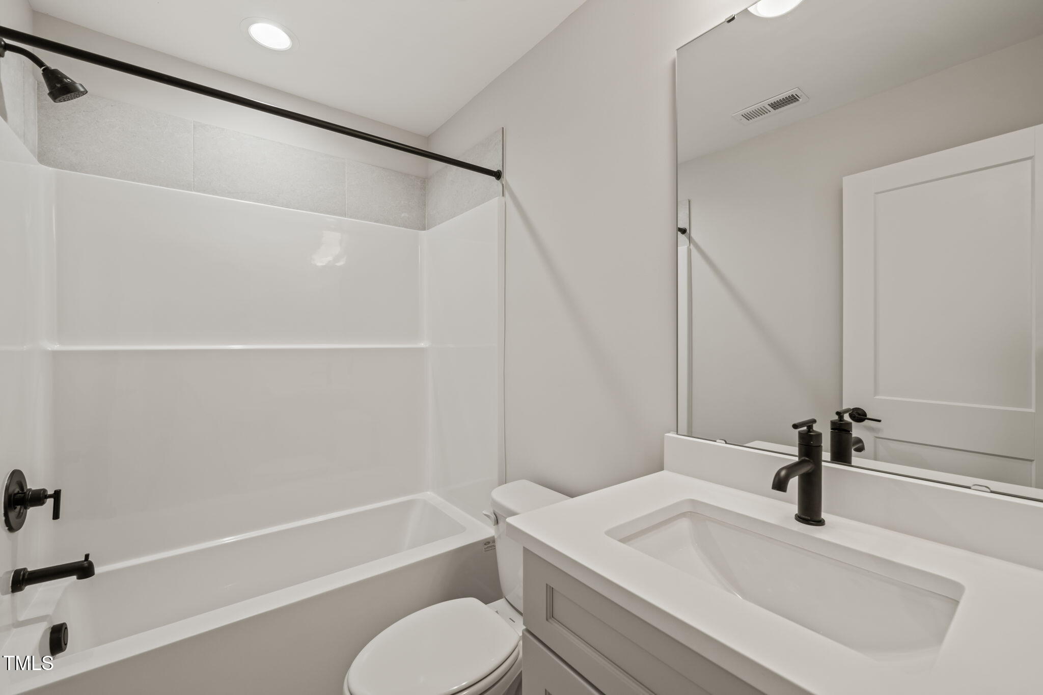 320 Pilot Ridge Road Zebulon, NC 27597 - Photo 34 of 49 a bathroom with a sink a toilet and a bathtub