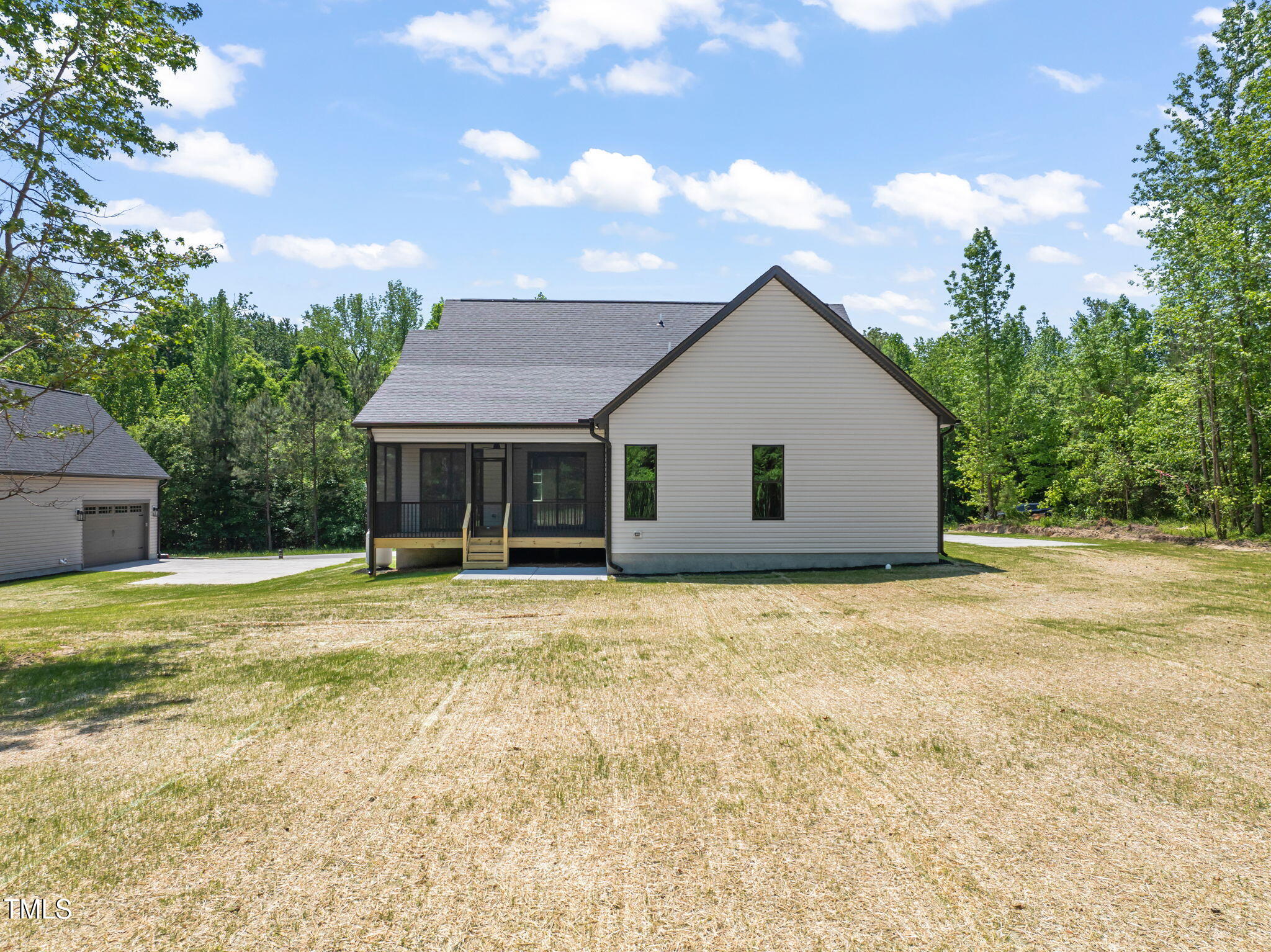 320 Pilot Ridge Road Zebulon, NC 27597 - Photo 46 of 49 a front view of house with yard and trees in the background