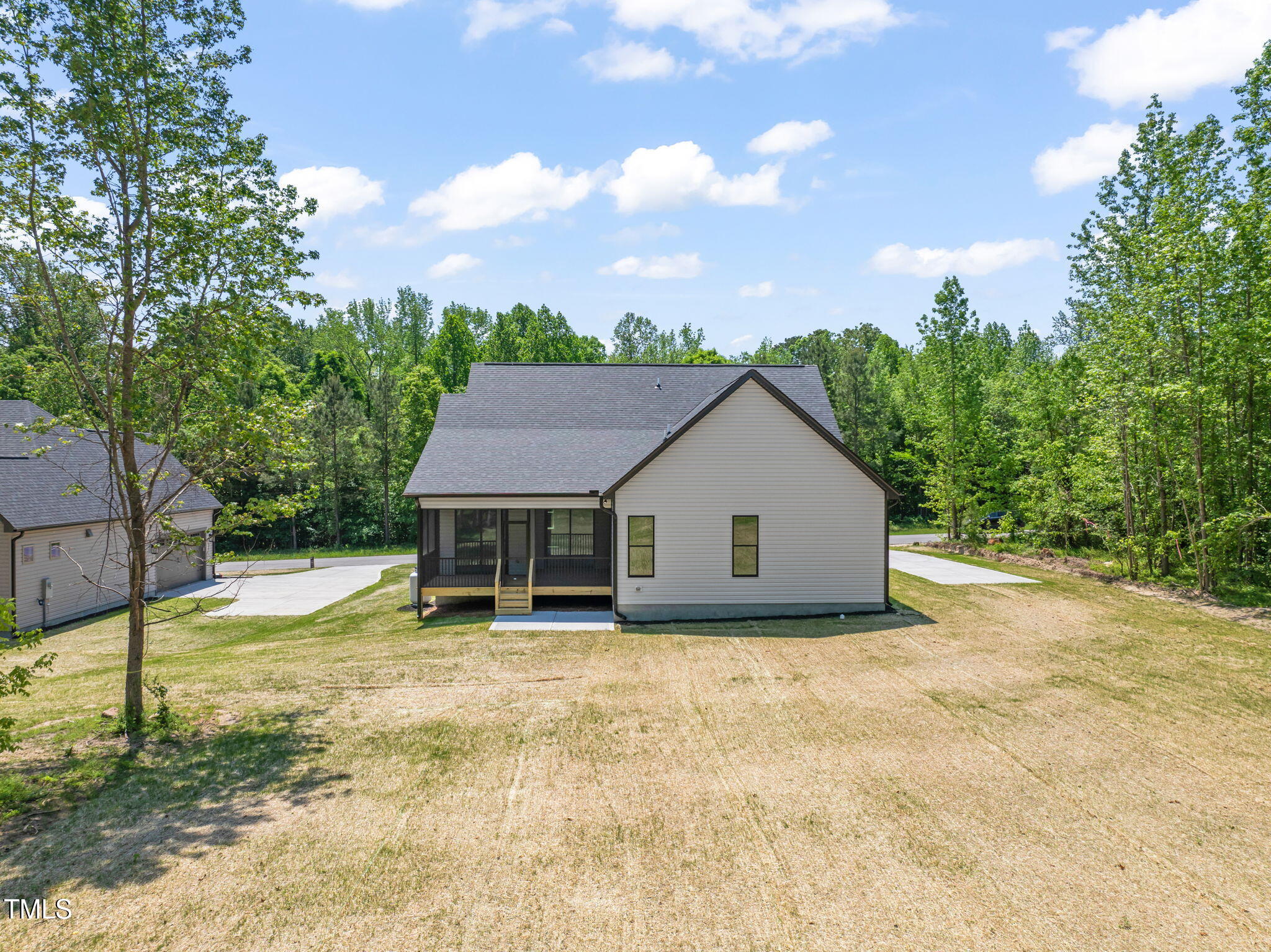320 Pilot Ridge Road Zebulon, NC 27597 - Photo 47 of 49 a view of a house with yard and sitting area