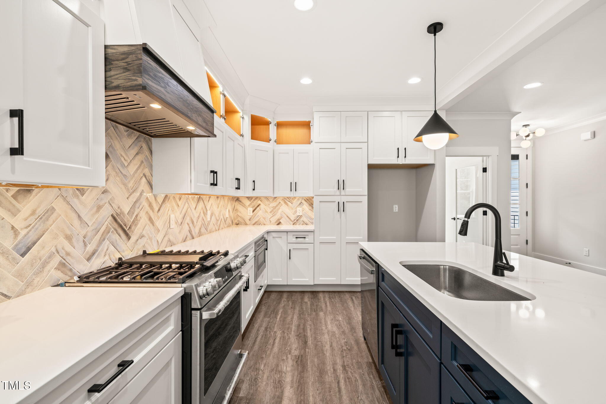 320 Pilot Ridge Road Zebulon, NC 27597 - Photo 9 of 49 a kitchen with a sink a stove and a wooden floors