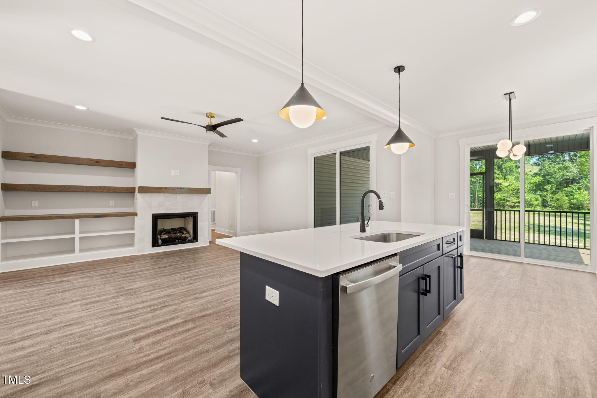 320 Pilot Ridge Road Zebulon, NC 27597 - Photo 10 of 49 a kitchen with a stove and a wooden floor