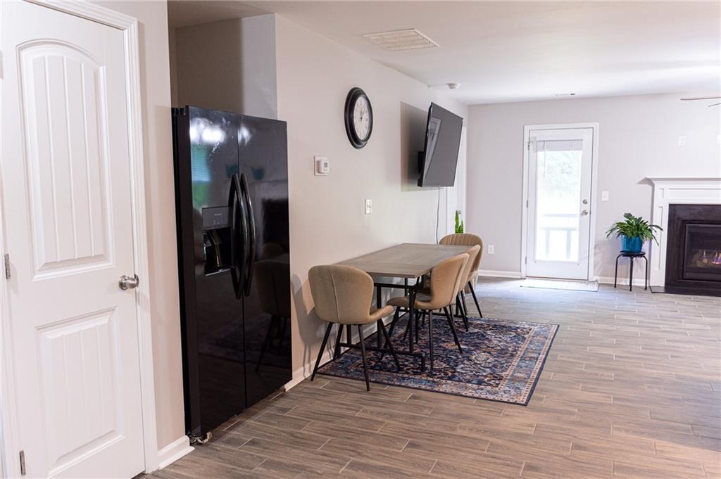165 Pine Ridge Road Covington, GA 30016 - Photo 9 of 28 a view of a dining room with furniture window and wooden floor